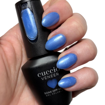 Cuccio Feeling Blue Bliss Pearlescent Blue gel nail polish applied on nails with glossy finish