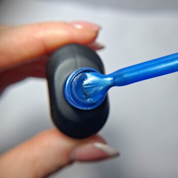 Cuccio Blue Bliss gel nail polish brush showing pearlescent blue highly pigmented colour