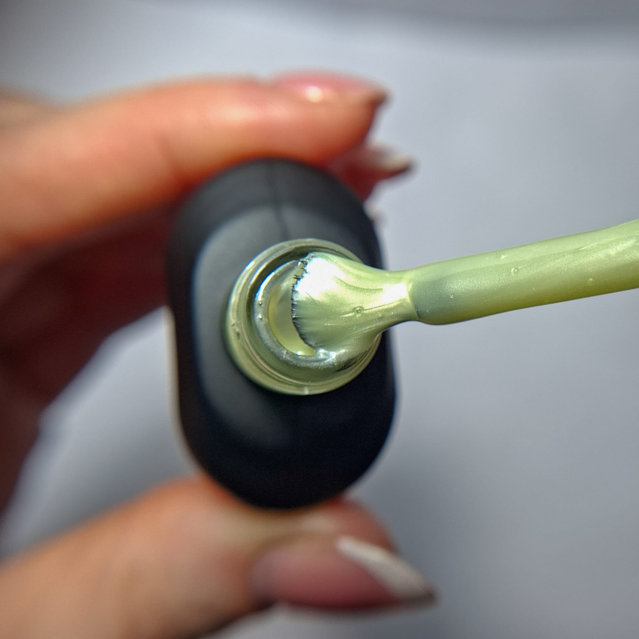 Cuccio Summer N Shine gel nail polish brush showing pearlescent green highly pigmented colour