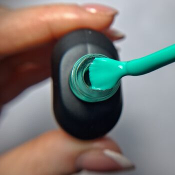 Cuccio Aqua Blue gel nail polish brush showing Aqua Blue highly pigmented colour