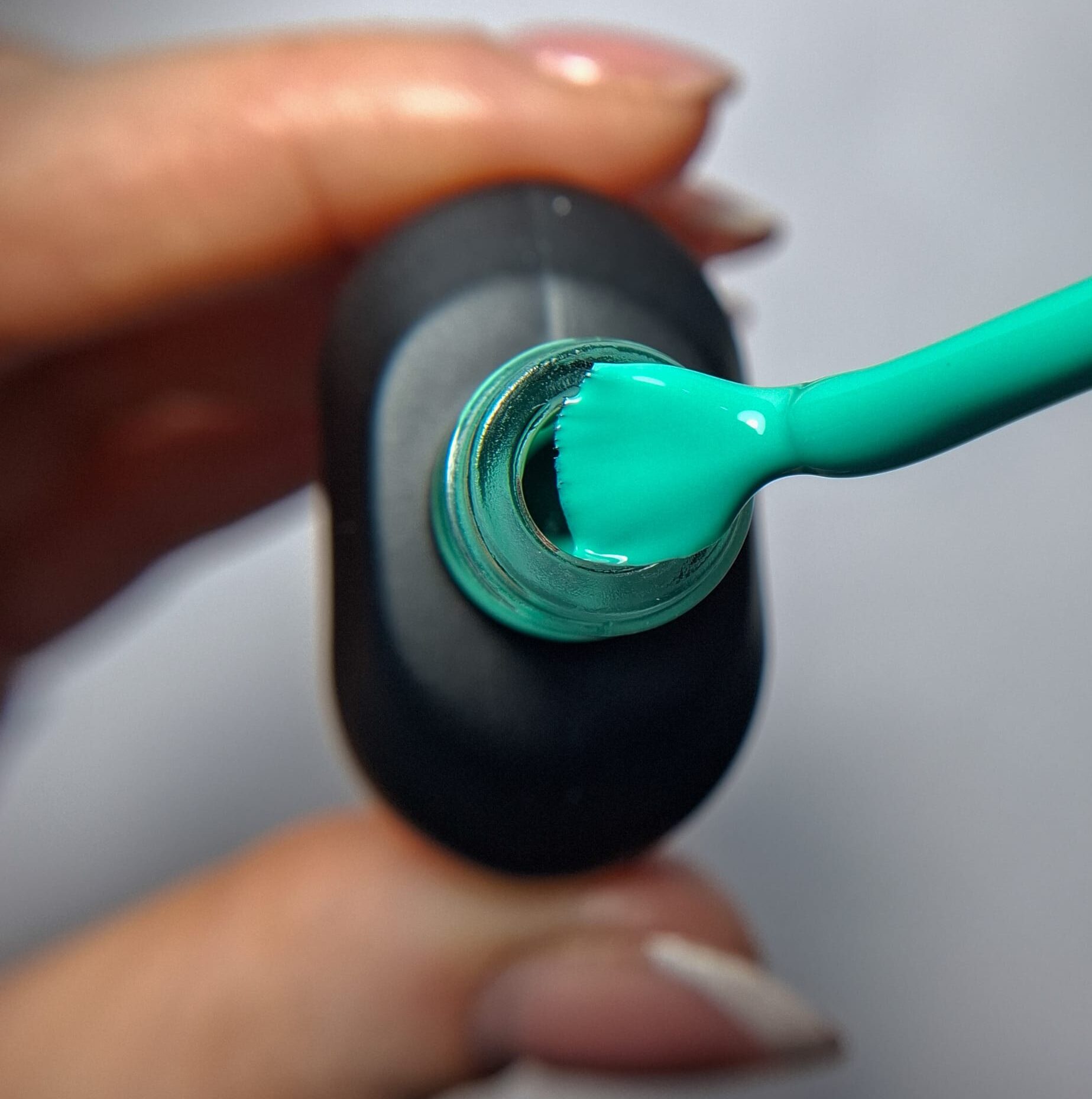 Cuccio Aqua Blue gel nail polish brush showing Aqua Blue highly pigmented colour